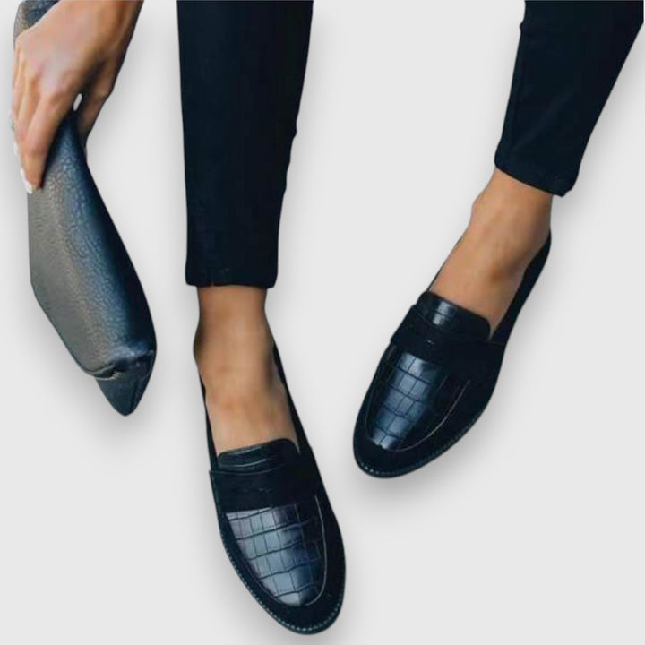 Men's black ergonomic slip-on loafers ensuring all-day comfort and classic versatile style.