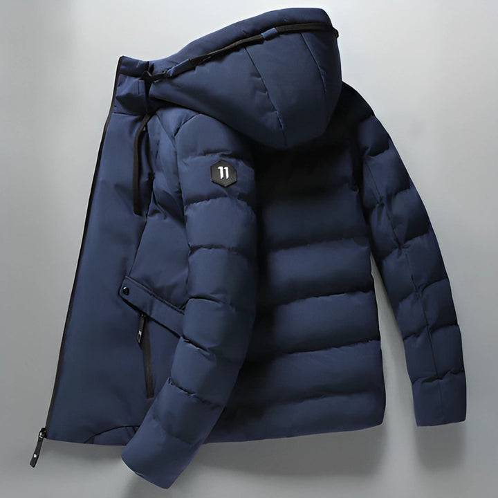 Black men's waterproof winter parka jacket, fleece-lined for ultimate warmth in cold weather.