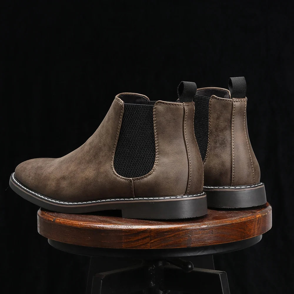 Durable black Men's Wyndham Chelsea Boots; slip-on ankle boots for dress or casual wear.