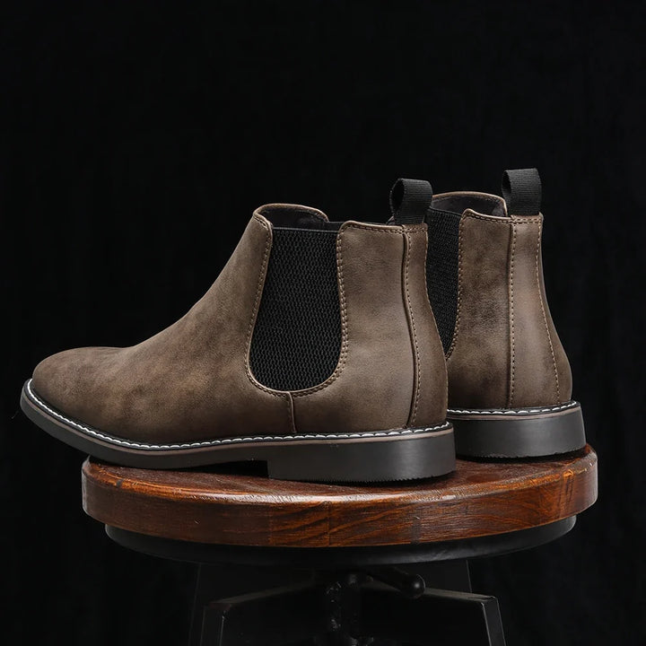 Durable black Men's Wyndham Chelsea Boots; slip-on ankle boots for dress or casual wear.