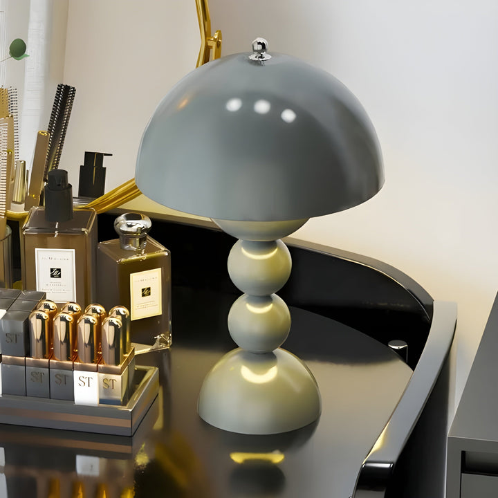 Yellow Scandinavian desk lamp, portable LED, brightens any stylish home setup.