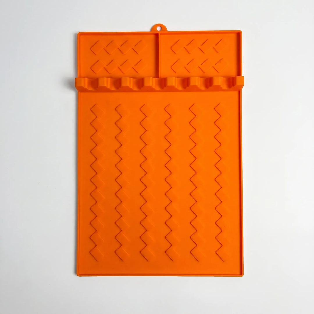 Organize BBQ & kitchen tools with this silicone utensil rest mat. Essential cooking tool holder & drip tray.