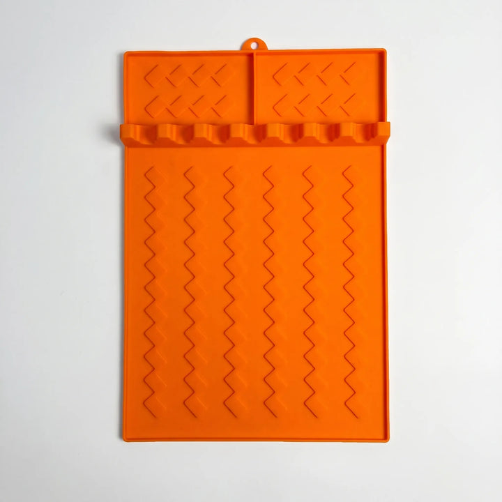 Organize BBQ & kitchen tools with this silicone utensil rest mat. Essential cooking tool holder & drip tray.