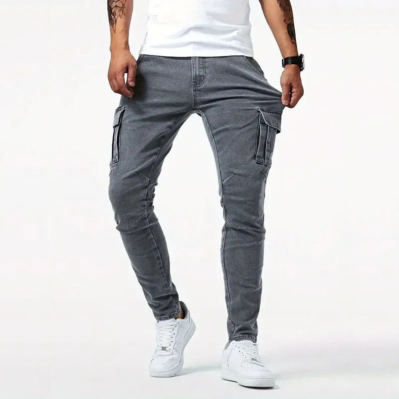 Modern gray slim-fit men's cargo pants, comfortable stretch fabric, ample utility pockets for everyday use.