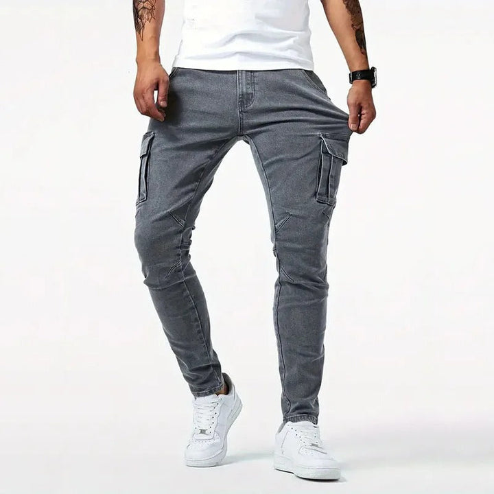Modern gray slim-fit men's cargo pants, comfortable stretch fabric, ample utility pockets for everyday use.