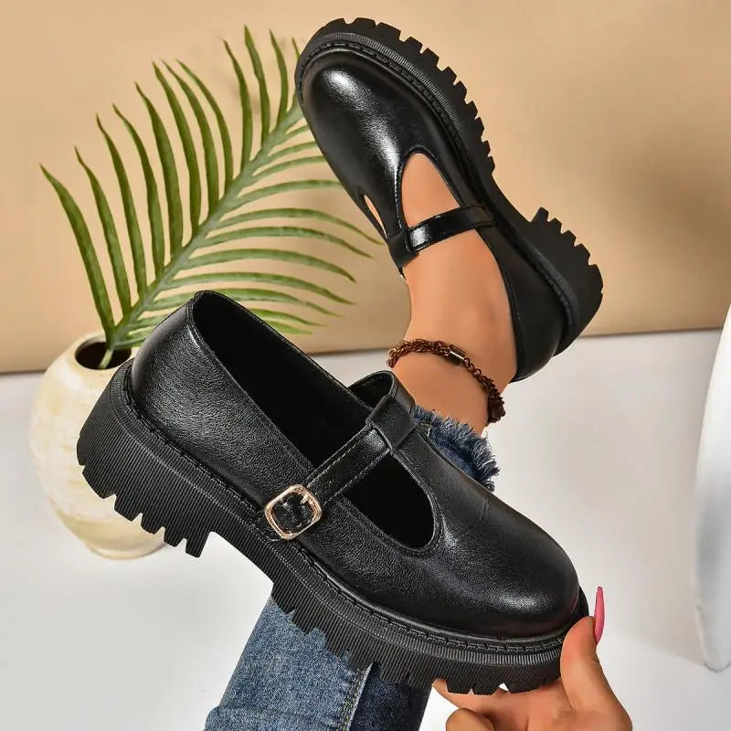 Women's T-strap black platform Mary Jane shoes with an adjustable buckle closure and orthopedic comfort features.