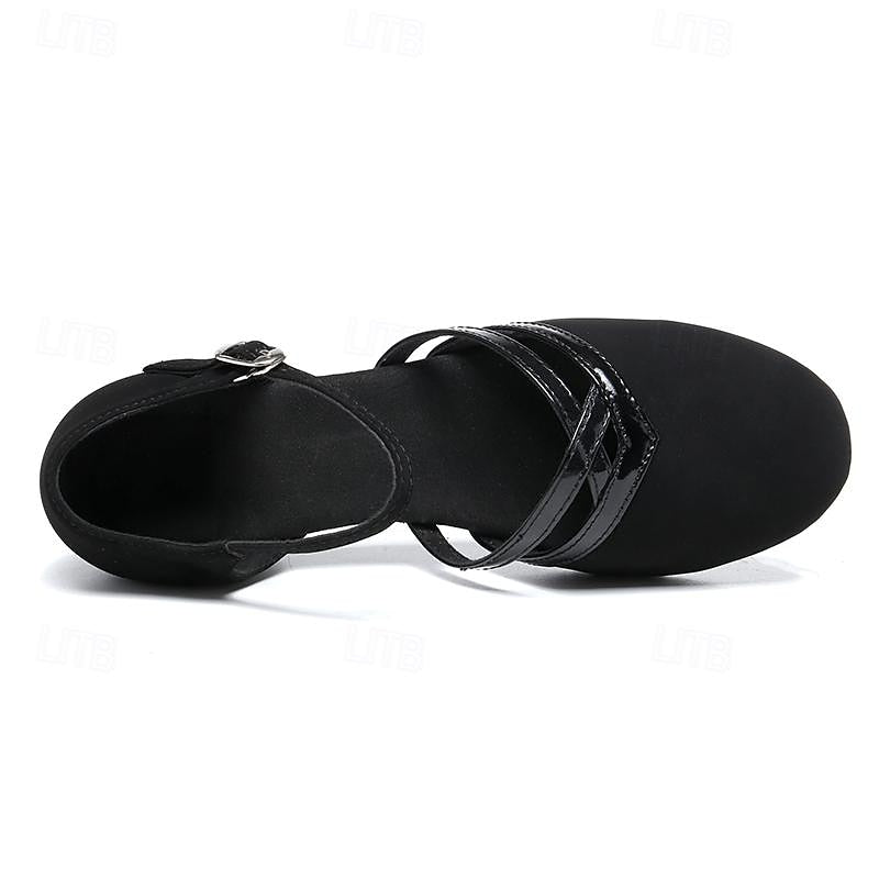 Graceful black women's dance shoes featuring a supportive ankle strap and low heel for stability.