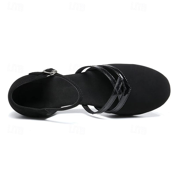 Graceful black women's dance shoes featuring a supportive ankle strap and low heel for stability.