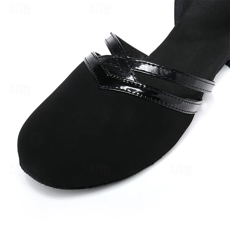 Stylish black women's performance dance shoes with an elegant ankle strap and comfortable low heel.