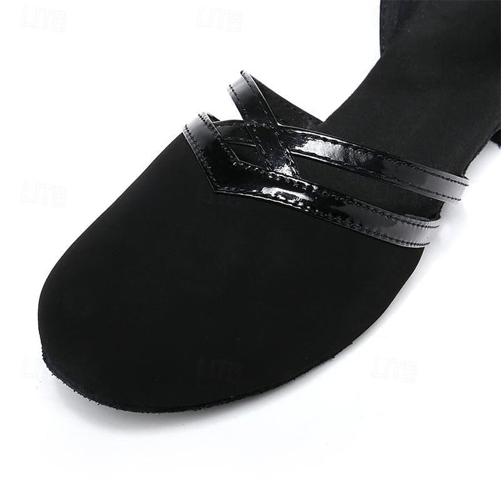 Stylish black women's performance dance shoes with an elegant ankle strap and comfortable low heel.