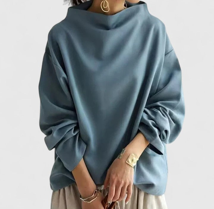 Blue women's classic high-neck long sleeve top, relaxed fit, offering elegant comfort and versatile style.