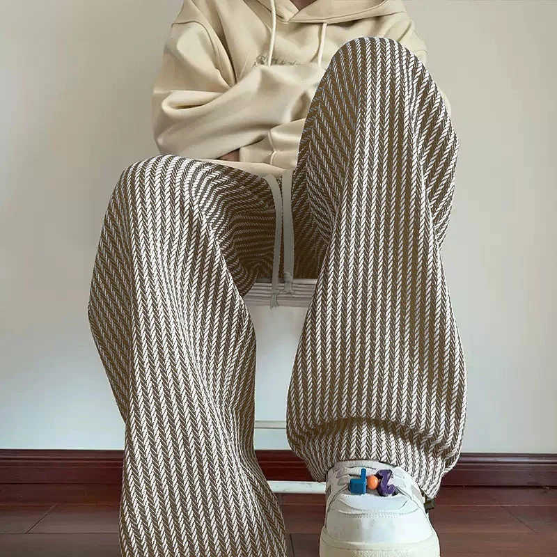 Pink women's wide-leg sweatpants with a fashionable herringbone design, ideal for casual wear.