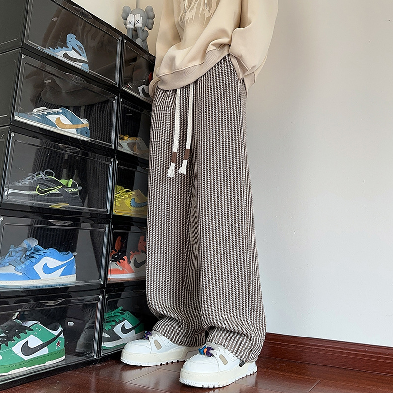 Relaxed fit black women's herringbone wide-leg sweatpants, offering ultimate comfort and style.