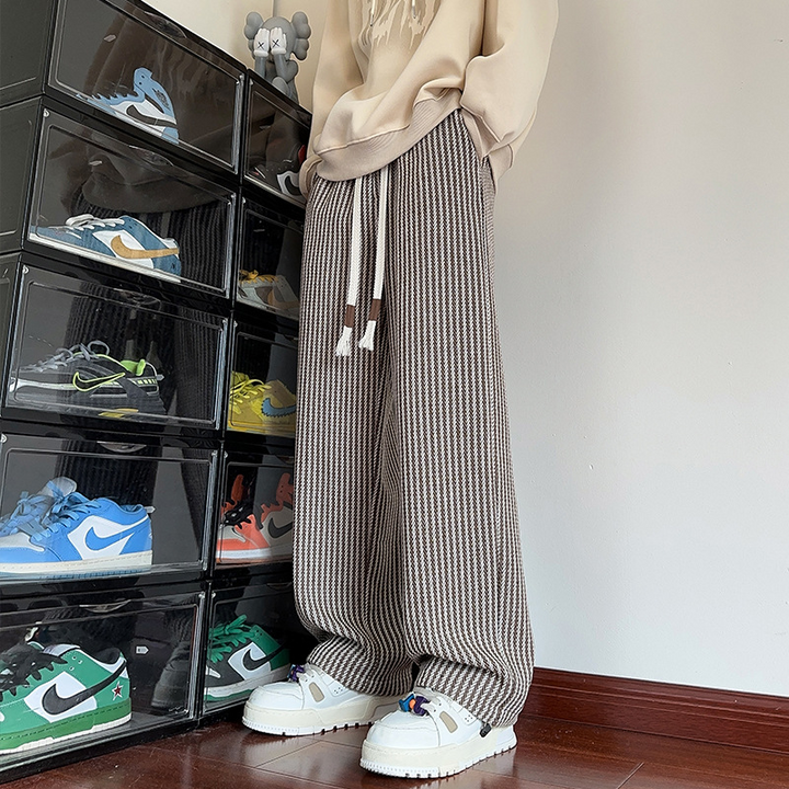 Relaxed fit black women's herringbone wide-leg sweatpants, offering ultimate comfort and style.