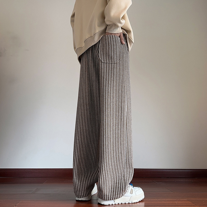 Stylish women's wide-leg sweatpants with a herringbone print and adjustable drawstring waist.