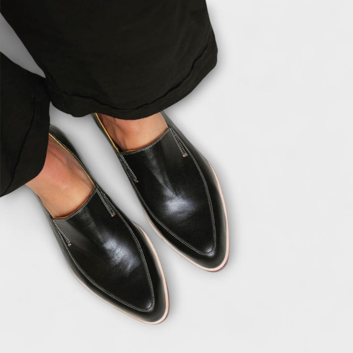 Supportive women's black loafers for versatile style. Orthopedic design ensures all-day comfort & foot health.