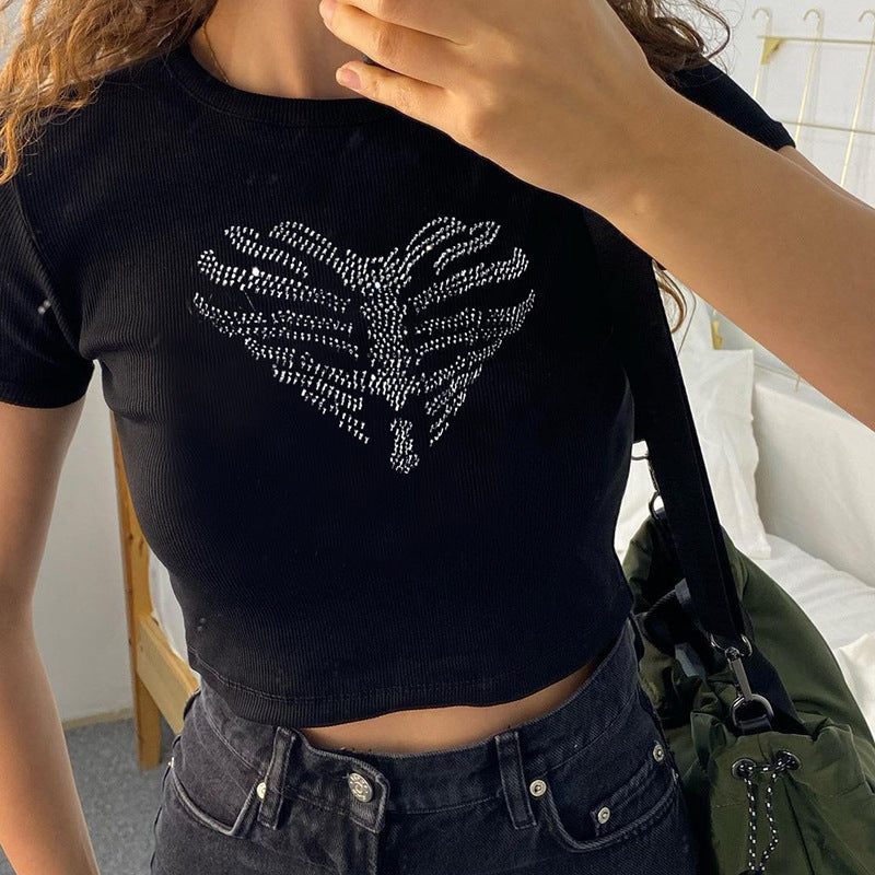 Fashionable women's skeleton crop top with intricate rhinestone details, a trendy party piece.