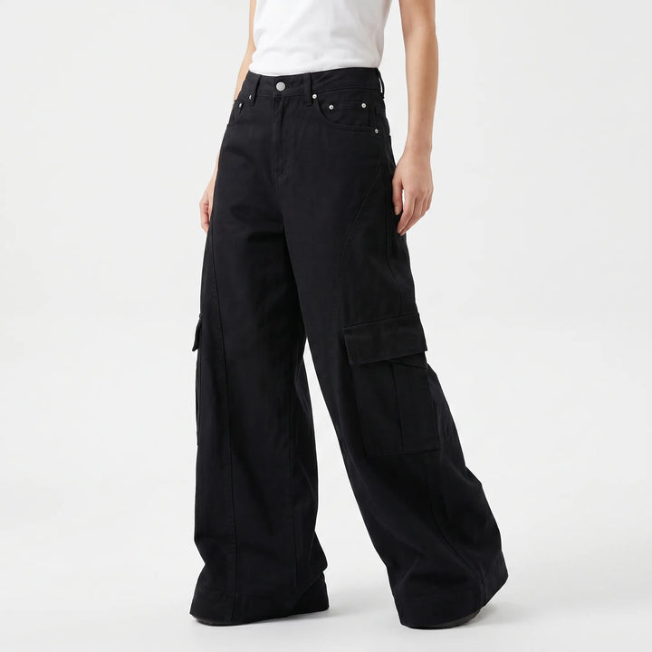 Brown women's wide-leg pants, high-waisted and baggy for comfortable, casual vintage fashion. Effortless style.