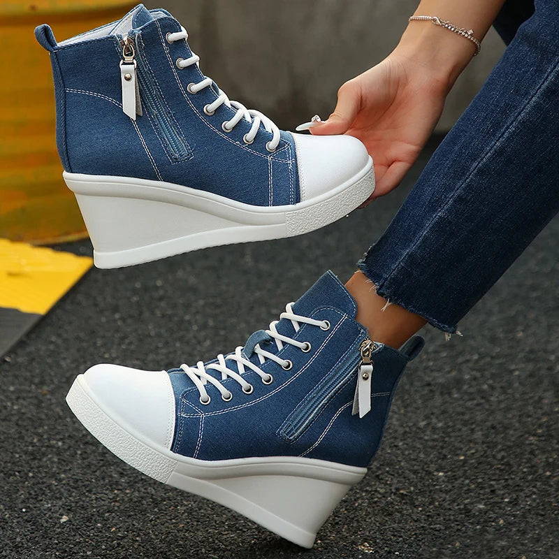 Women's Comfort Wedge Sneakers with hidden lift, available in black, ivory, & denim blue.