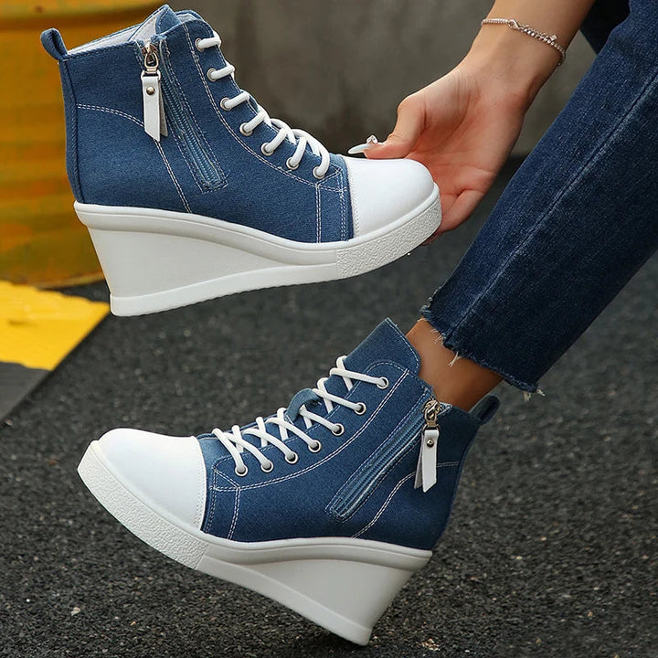 Women's Comfort Wedge Sneakers with hidden lift, available in black, ivory, & denim blue.