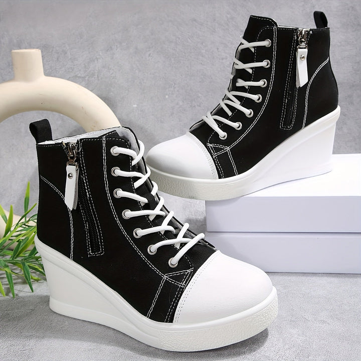 Trendy Women's Platform Wedge Sneakers in black, ideal for fashion-forward casual looks.