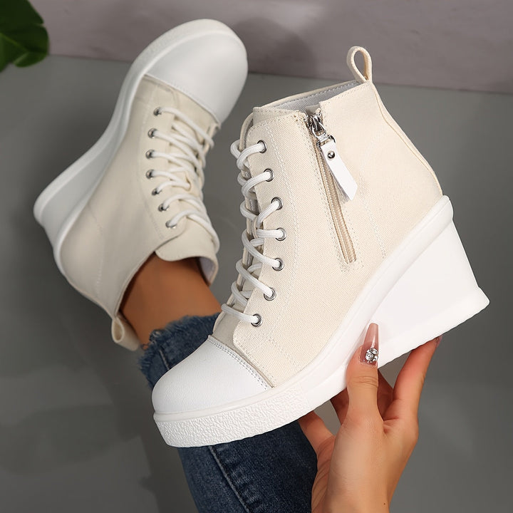 Streetwear Women's Hidden Wedge Sneakers in ivory, combining comfort with contemporary style.