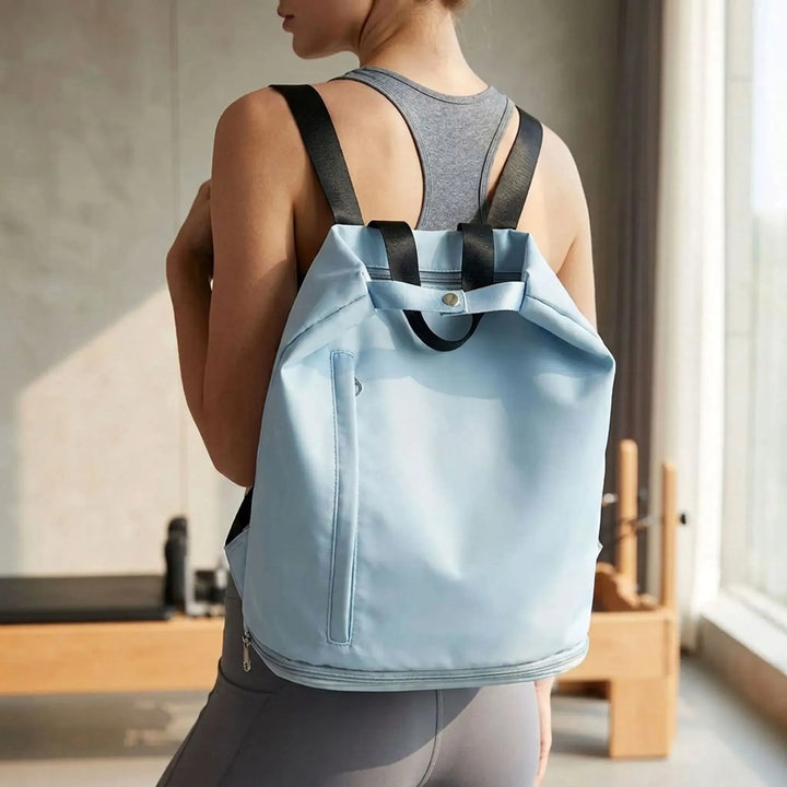 Black women's wet/dry travel sports backpack with a shoe compartment, ideal for gym, swimming, or weekend trips.