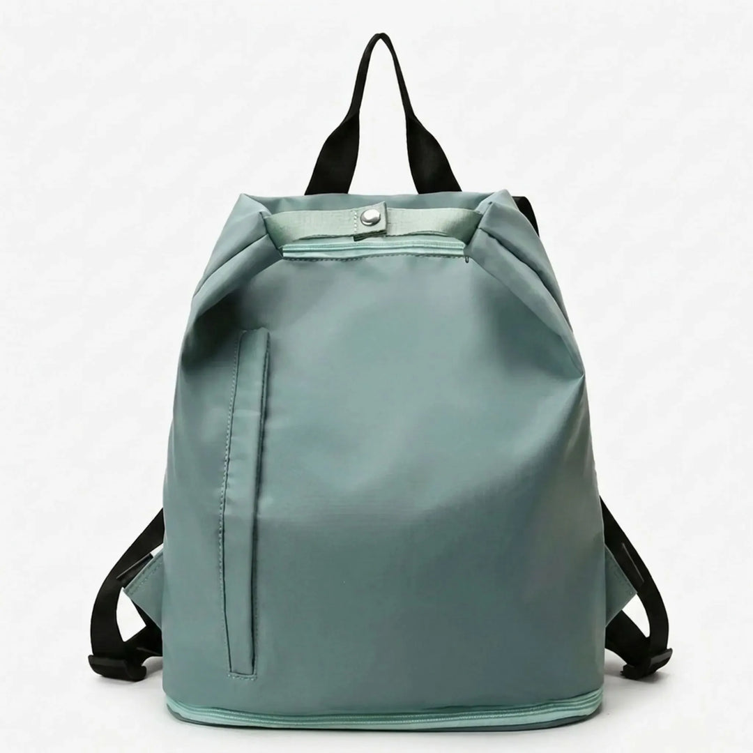 Spacious women's wet/dry sports backpack with shoe storage, designed for active women's gym, swim & travel needs.