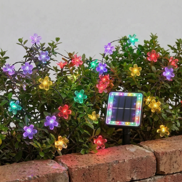 Beautiful solar flower string lights emitting a warm glow, enhancing outdoor living spaces and garden ambiance.