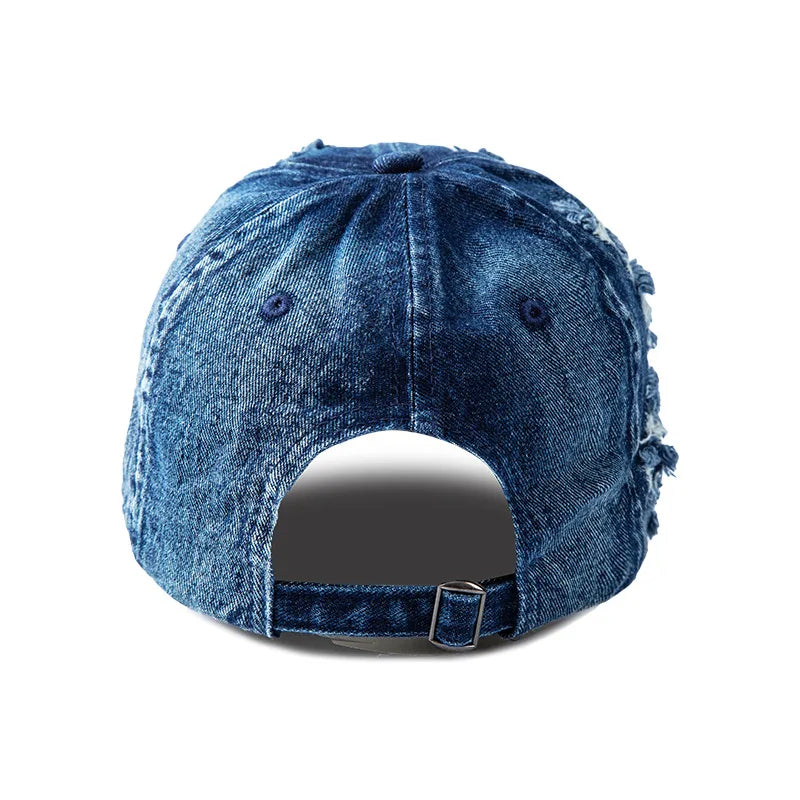 Casual distressed blue denim cap for unisex wear. Features a raw edge & adjustable fit, ideal for streetwear fashion.