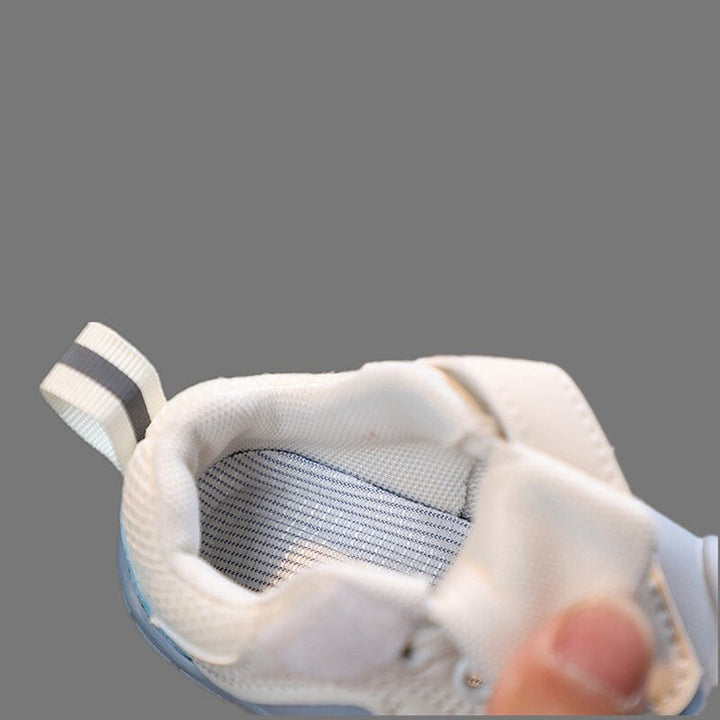 Blue FlexiToes infant barefoot sneakers, flexible & protective for healthy foot development.