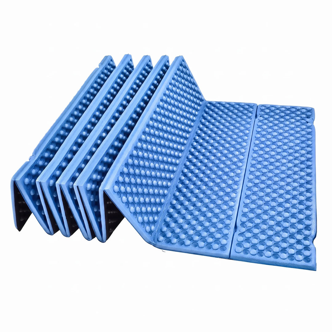 Durable closed-cell foam sleeping pad, blue and foldable for camping.