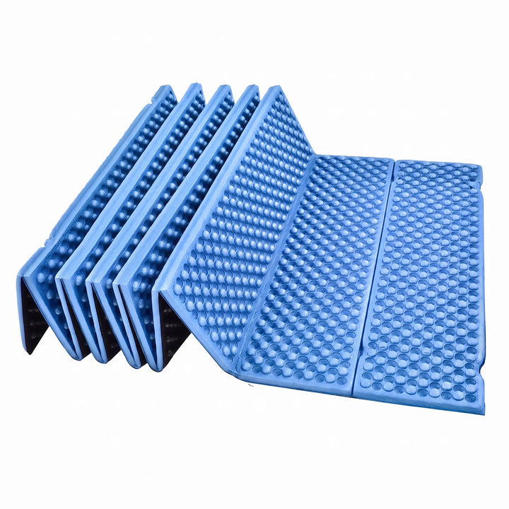 Durable closed-cell foam sleeping pad, blue and foldable for camping.