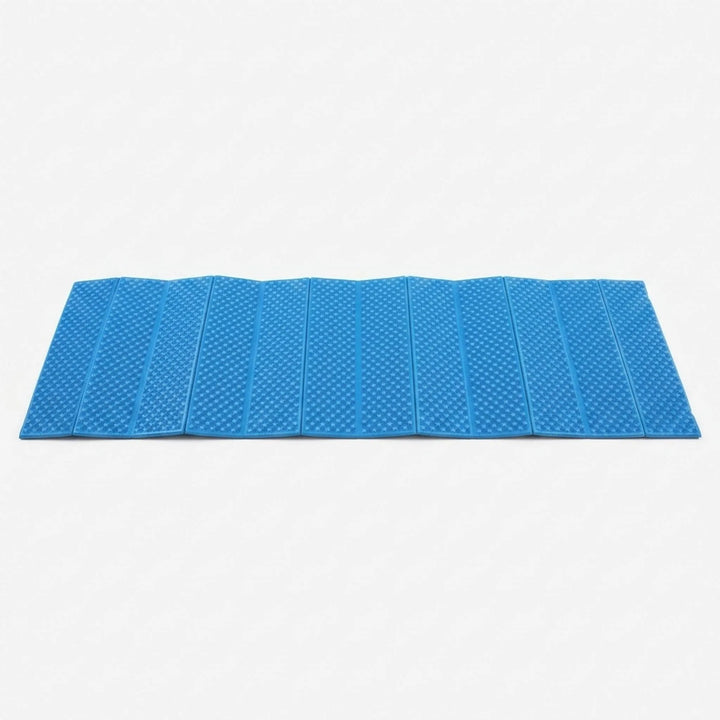 Blue closed-cell sleeping pad, foldable for comfortable outdoor camping.