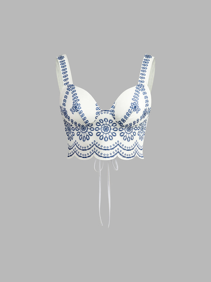Chic women's printed two-piece set featuring a sleeveless tie-back top and a matching midi skirt.