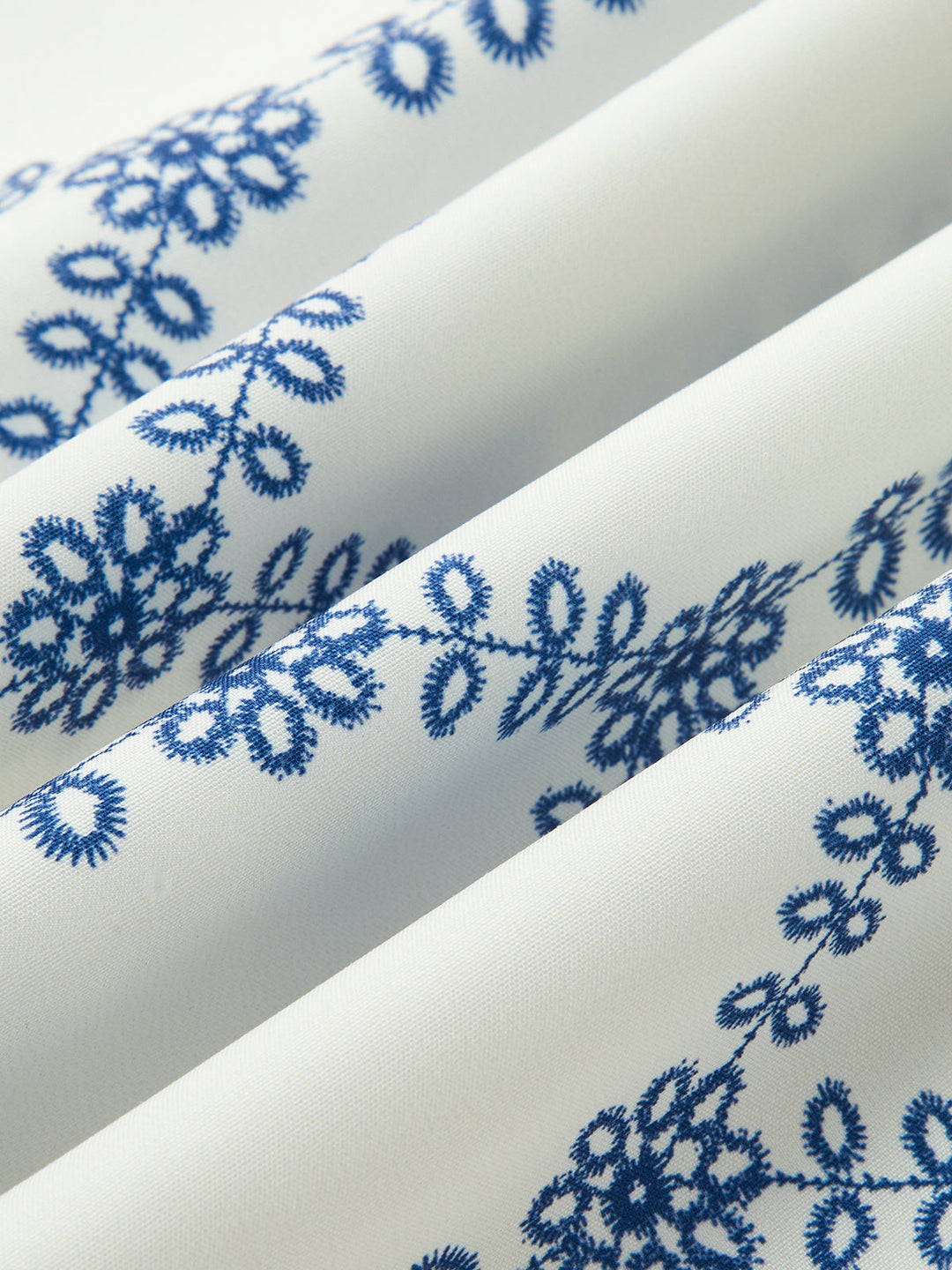 Casual yet elegant women's blue printed sleeveless tie-back skirt set, perfect for warm weather.