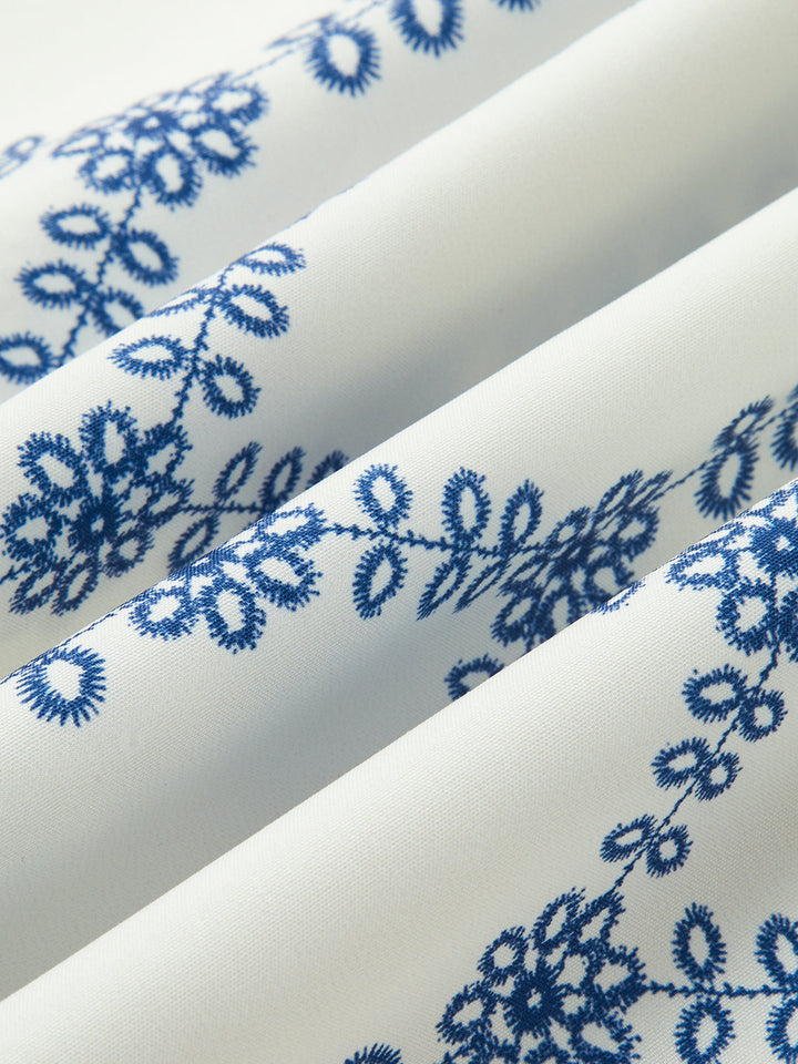 Casual yet elegant women's blue printed sleeveless tie-back skirt set, perfect for warm weather.