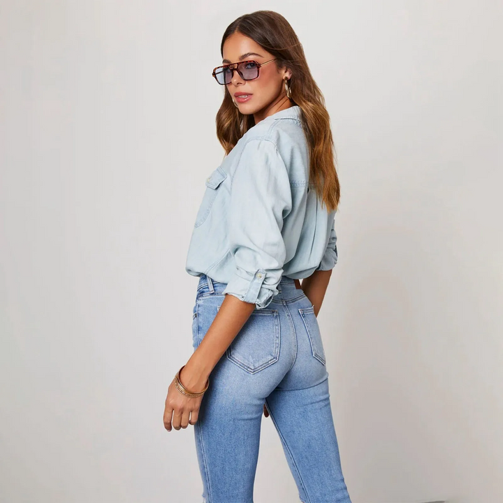 Effortless style with this women's blue button-up shirt, long sleeve, featuring a comfortable relaxed fit for casual fashion.
