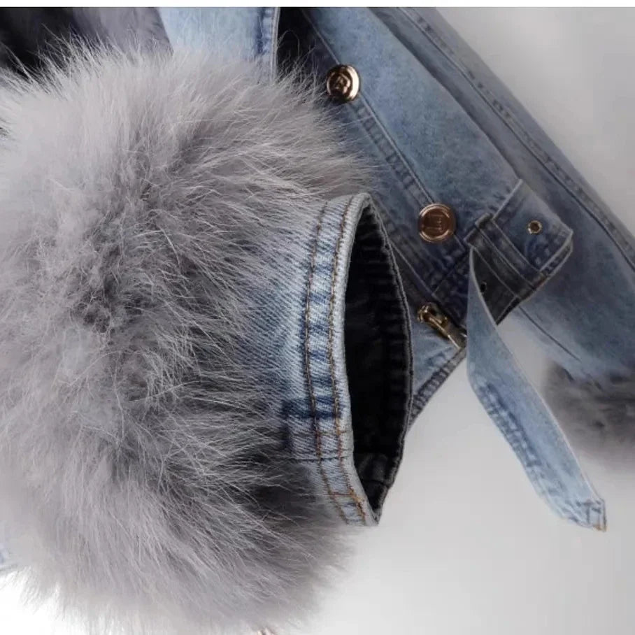 Elegant women's blue winter jacket featuring cozy faux fur trim, perfect for layered, chic fashion.