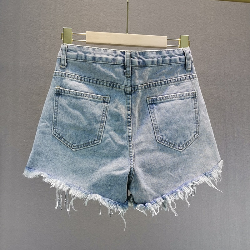 Comfortable blue women's shorts for everyday wear. Versatile summer apparel, ideal for casual warm weather outfits.
