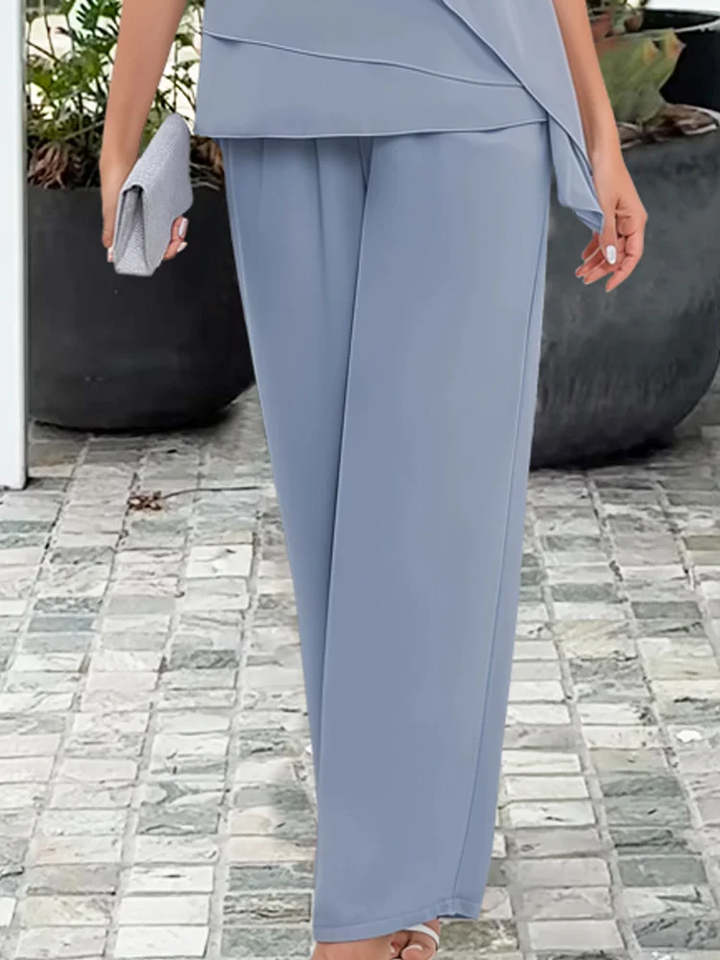 Graceful blue women's overlay top & straight-leg pants set. Coordinated, comfortable, and elegant two-piece fashion.