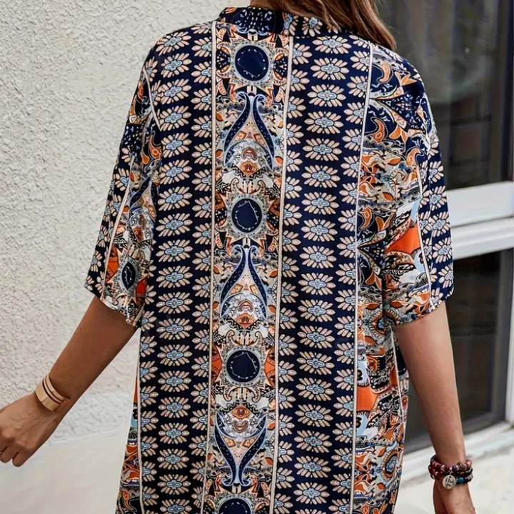 Trendy blue women's two-piece shorts set with a flowing kimono top. Comfortable polyester summer fashion outfit.