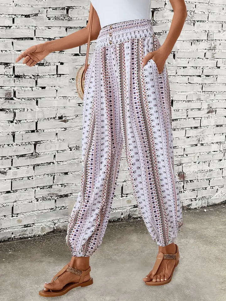 Women's smocked waist trousers with vibrant bohemian graphic print for casual wear