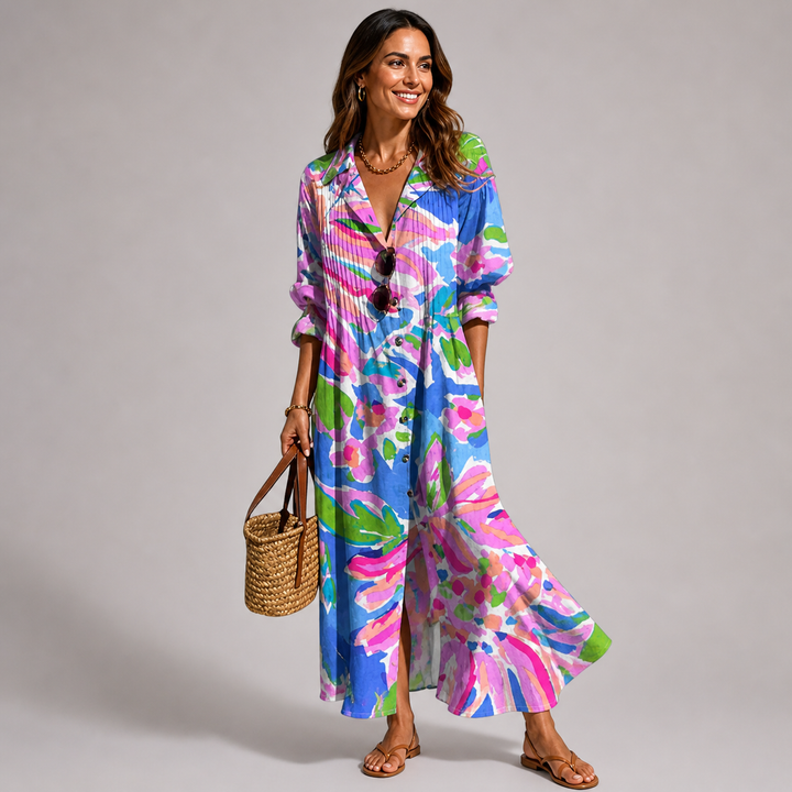 Comfortable women's bohemian maxi dress with vibrant print, button-front, V-neck, and long flowy sleeves.