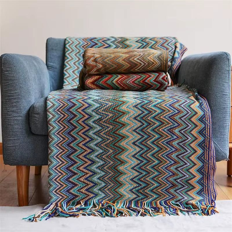 Elegant boho striped throw blanket featuring playful tassels, ideal for charming home decor.