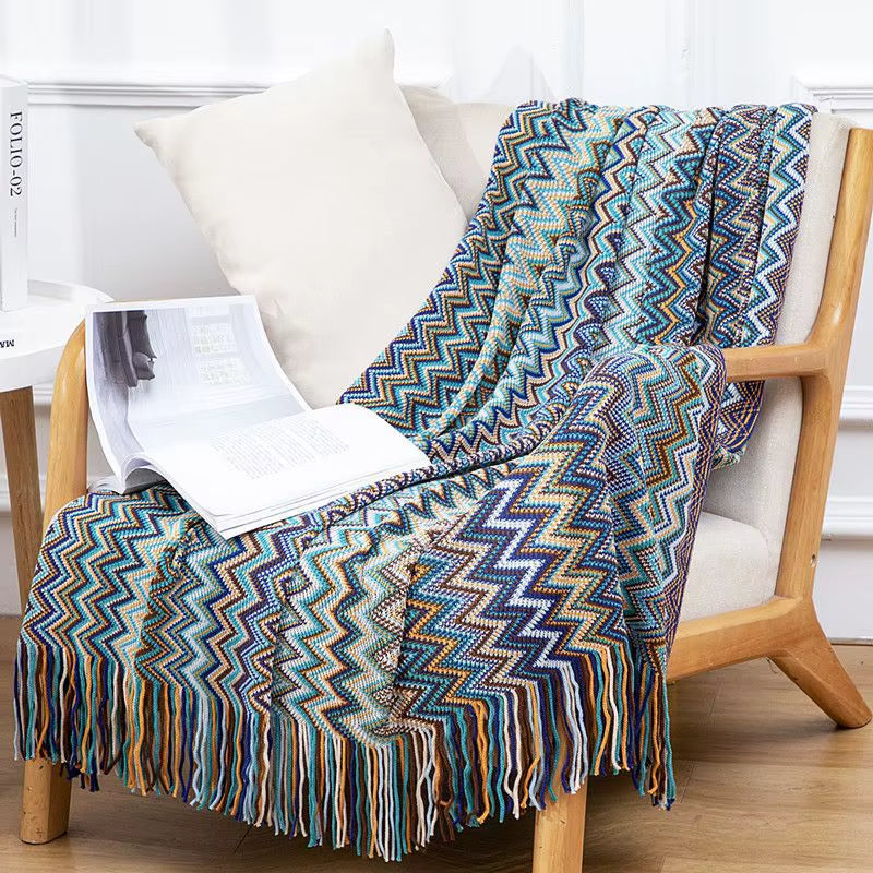 Soft & breathable boho throw blanket, striped pattern & tassels for cozy, stylish decor.