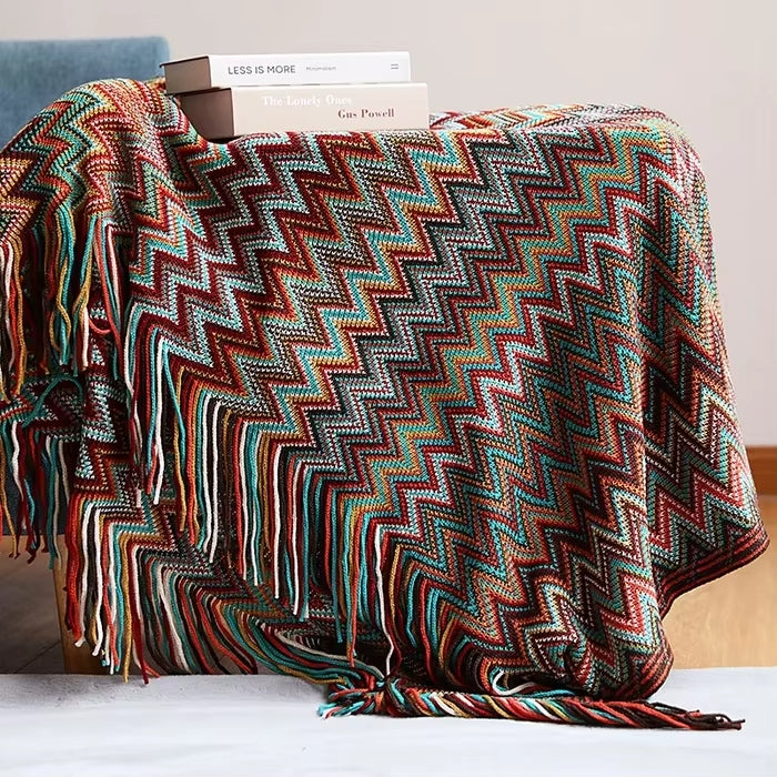 Stylish boho throw blanket, striped design with tassels, perfect for soft home accents.
