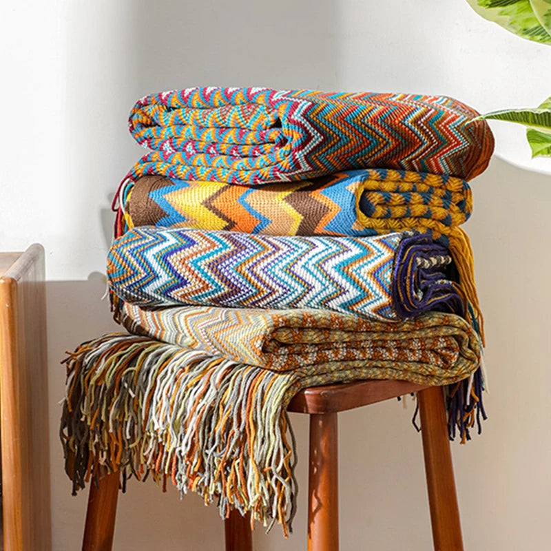 Soft boho striped throw blanket with elegant tassels, enhancing your home decor beautifully.