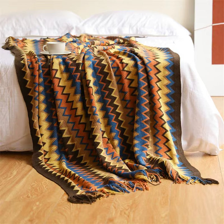 Cozy striped boho blanket with elegant tassels, ideal for stylish home decor and comfy accents.