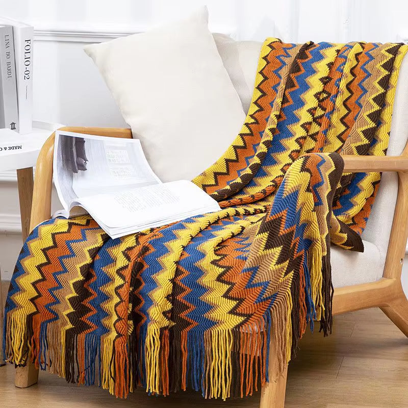 Breathable striped throw blanket, boho style with tassel fringe, perfect home decor accent.